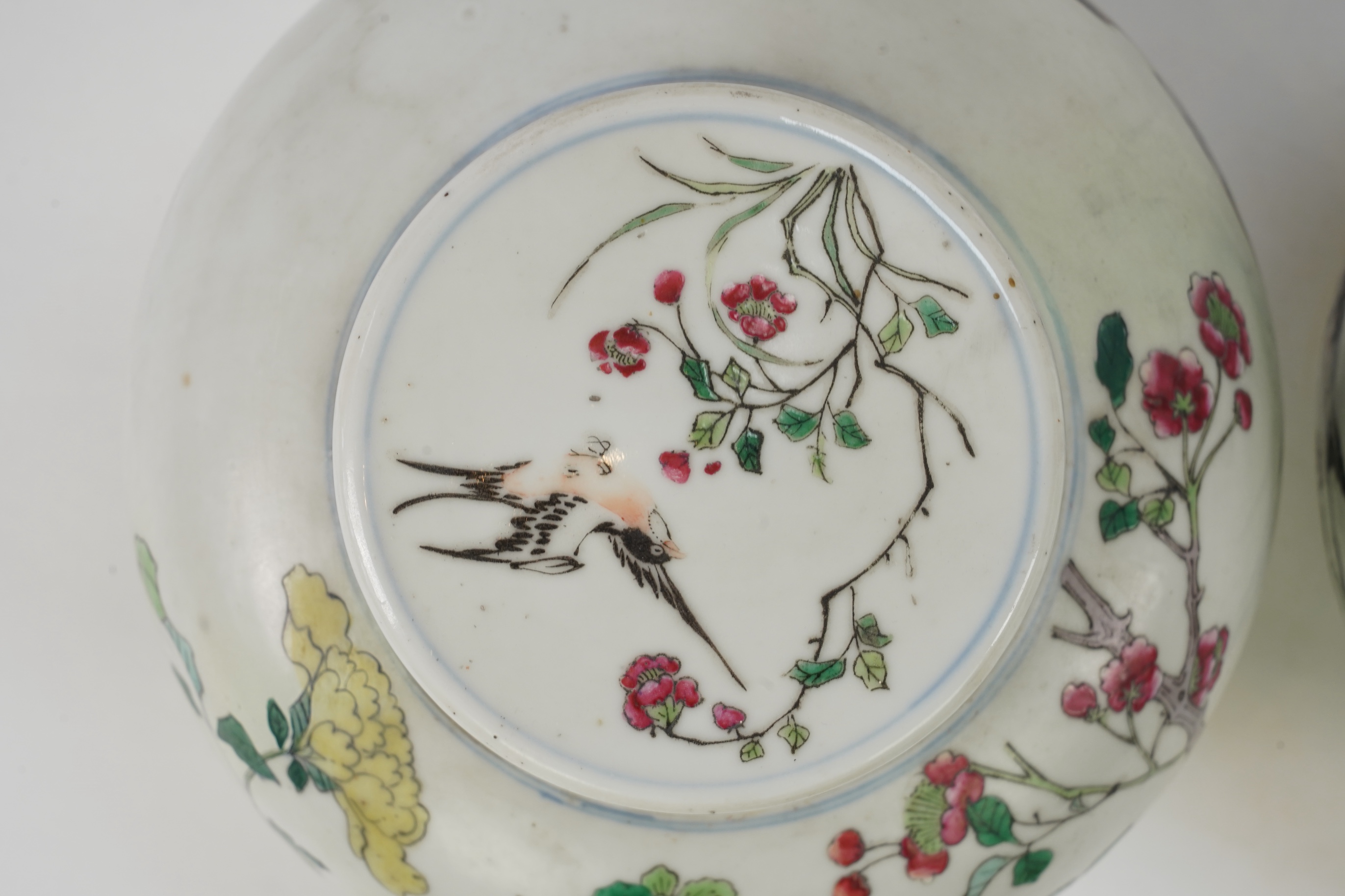 A pair of Chinese famille rose jars and covers, Kangxi mark but late 19th/early 20th century